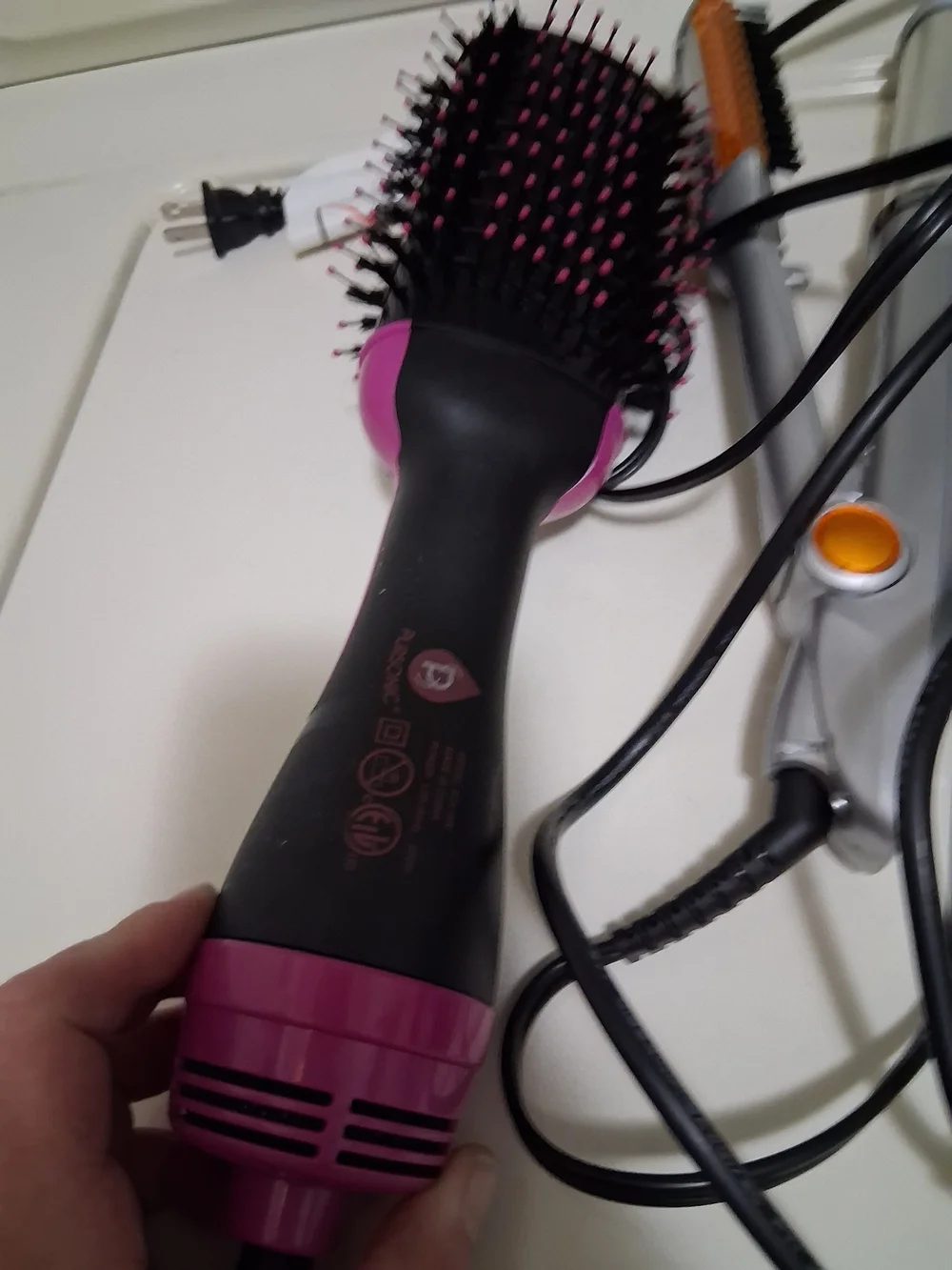 Pink and Black Hot Air Hair Brush Dryer And Various Styling Items